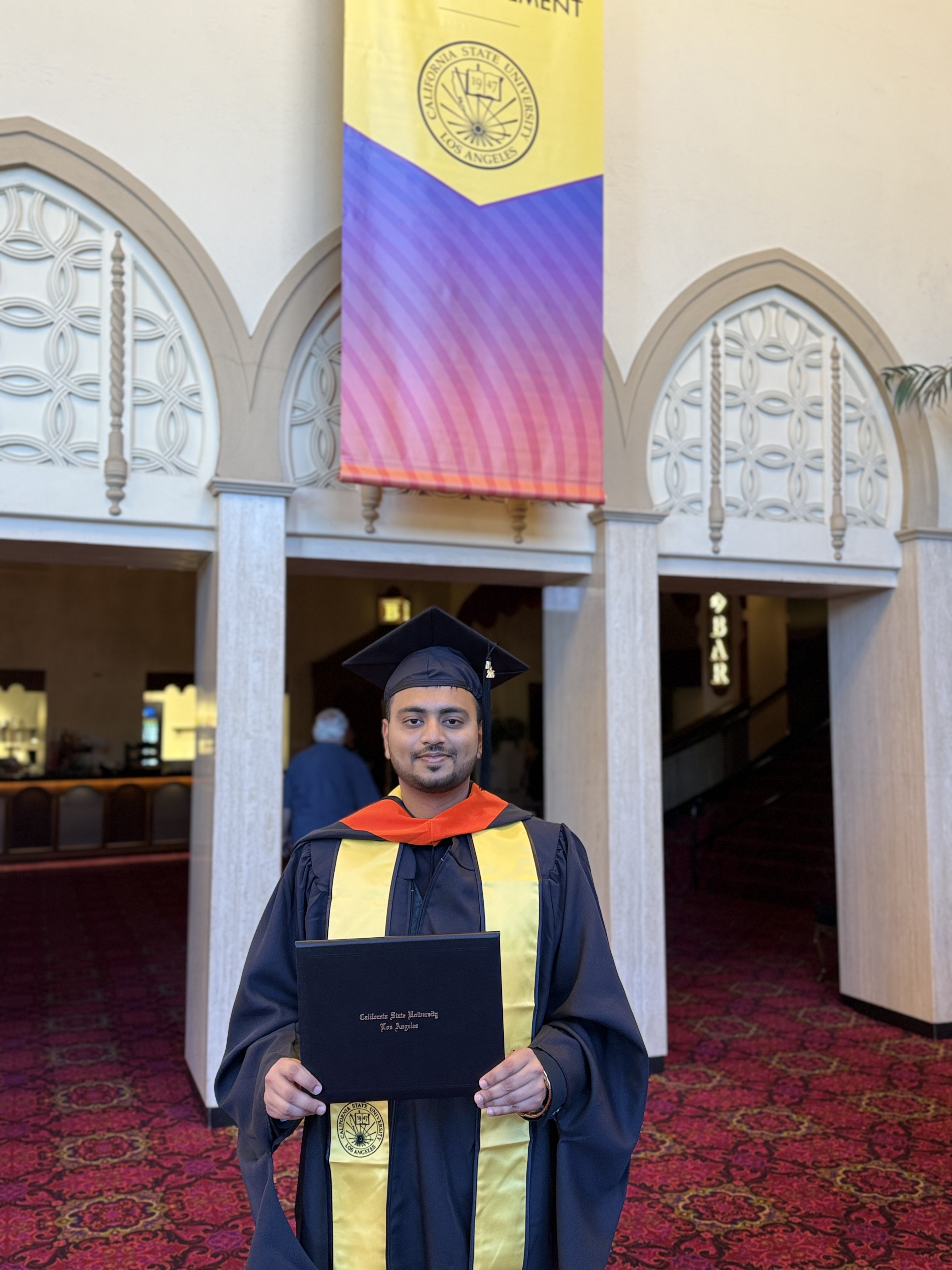 Vedant Kankate wearing his graduation cap and gown
